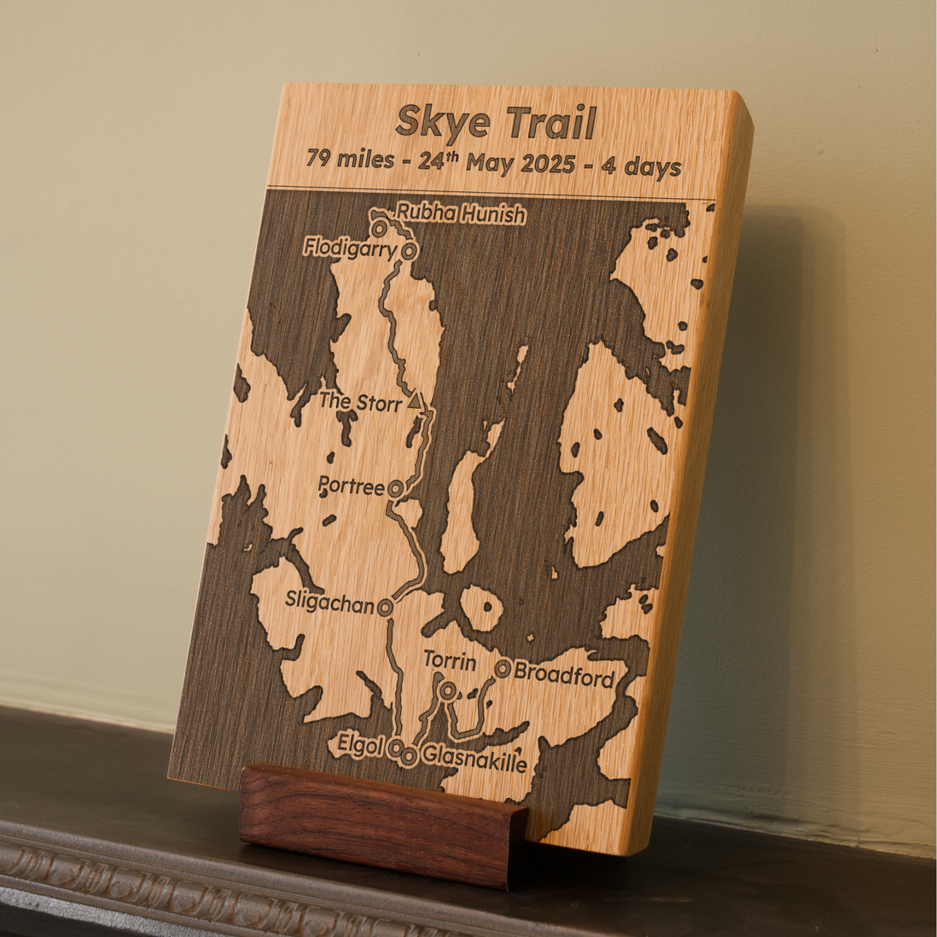 Wooden plaque depicting the Skye Trail map, showing route details and date.